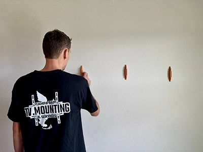 TV mounted into wall studs safely