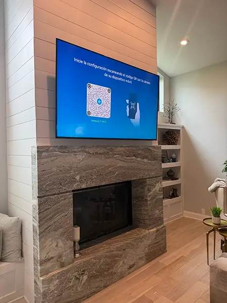 Professional TV mounting above a fireplace