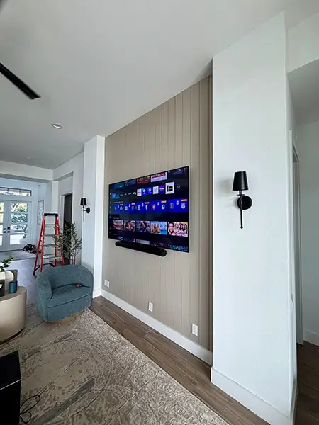 Wall-mounted TV and soundbar installation